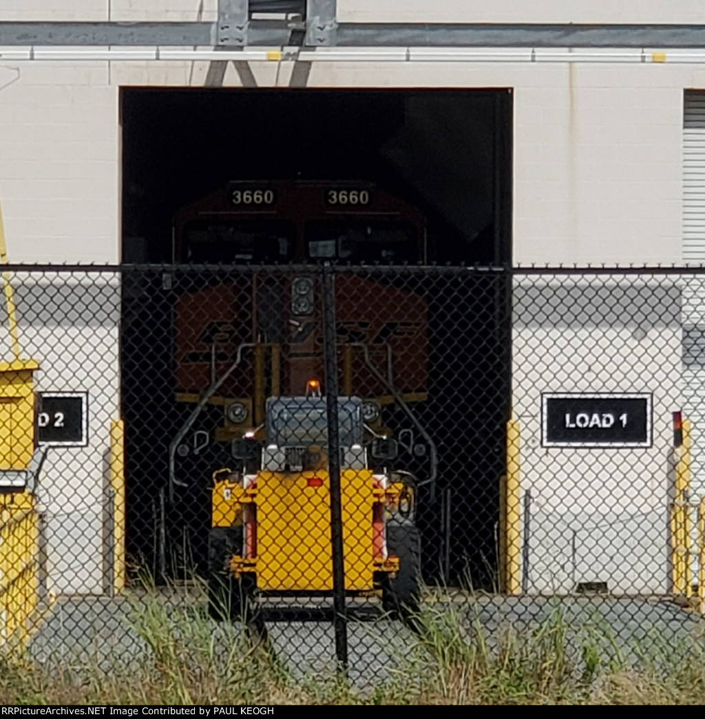 Close Up Shot of BNSF 3660, Transfer Dolly, and Bobcat.